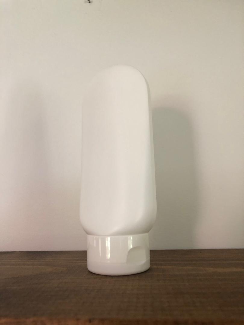 white 2 oz. tottle bottle